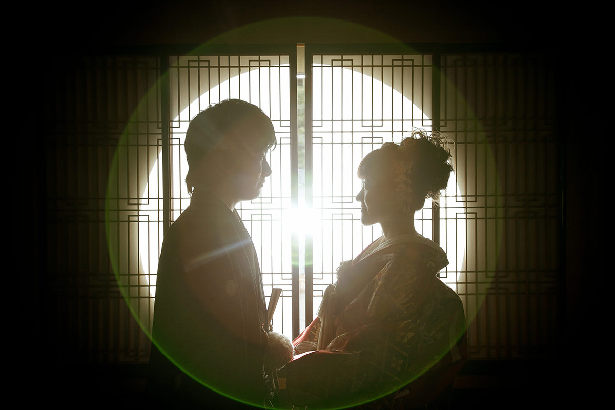 A couple looking at each other romantically wearing kimono for pre-wedding photo