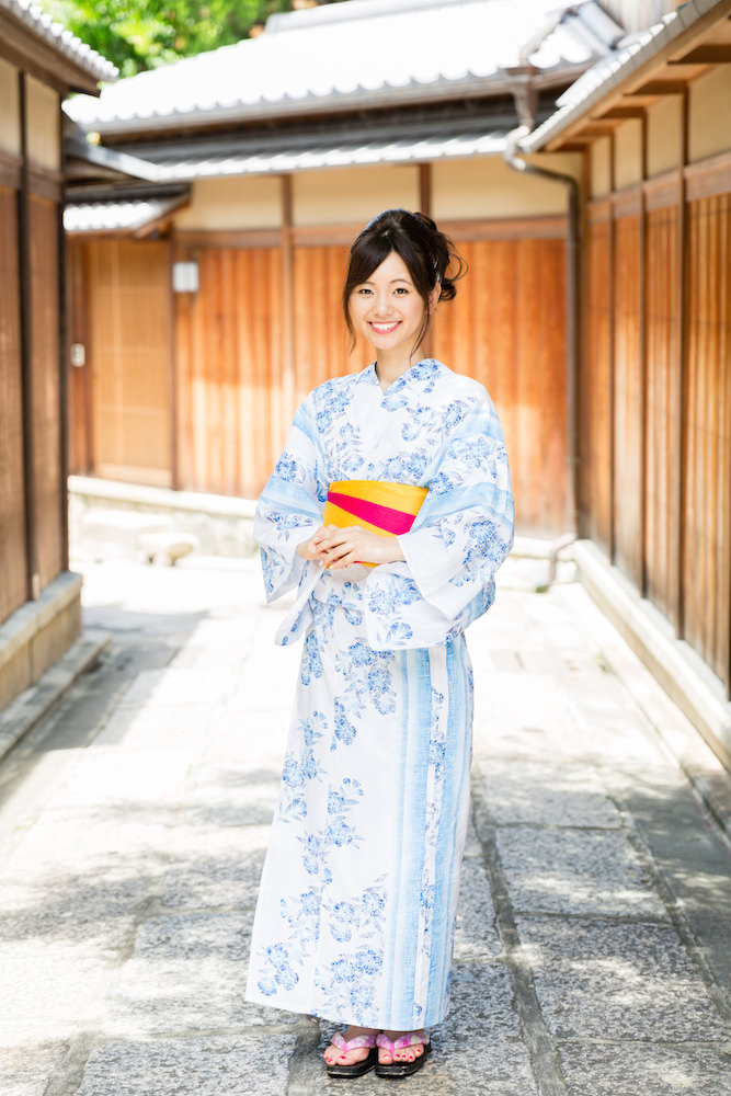 A woman dressed in blue kimono in Gion, Kyoto