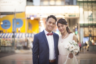 Pre-wedding photo of a couple smiling at the camera at Shinsaibashi, Osaka